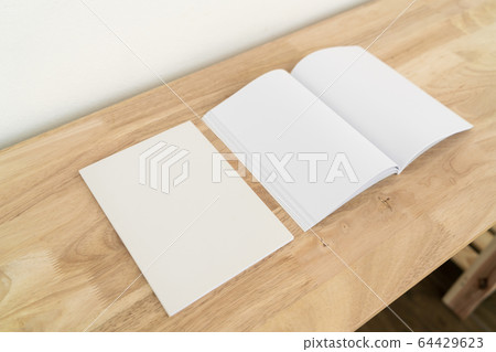 Blank catalog, magazines, book on wood background. 64429623