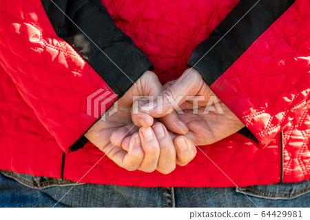Senior hands behind the back Senior hands behind the back 64429981