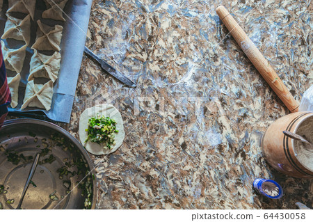 Woman cooking at home 64430058