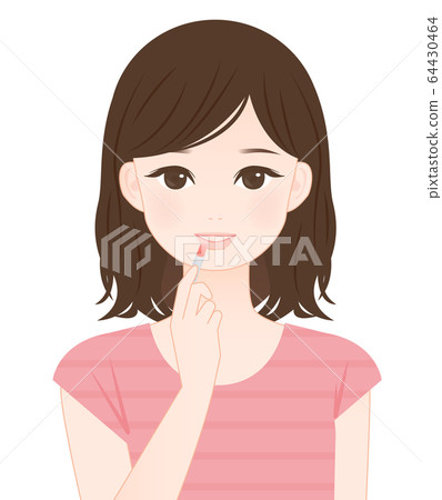 Woman doing lipstick 64430464