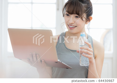 Female yoga fitness home laptop 64430987
