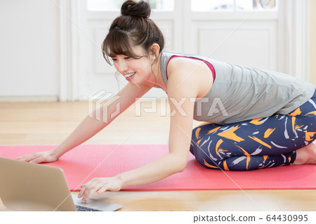 Female yoga fitness home laptop 64430995