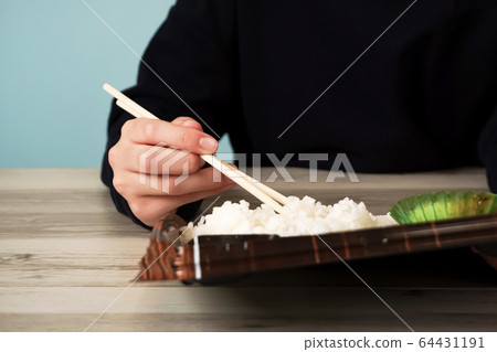 Take-out meal, person eating lunch Take-out meal, person eating lunch 64431191