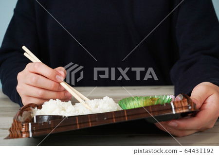 Take-out meal, person eating lunch Take-out meal, person eating lunch 64431192