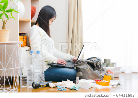Women's computer search copy space for disaster preparedness 64431692