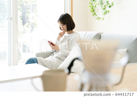 Female smartphone housewife 64431717