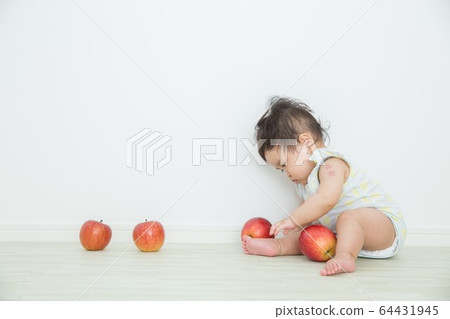 Baby and apple 64431945