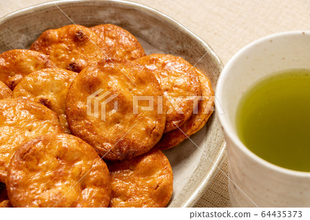 Soy sauce rice cracker. 64435373