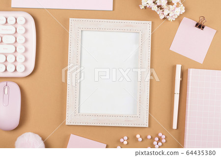 flat lay stationery on work desk in brown pastel background 64435380
