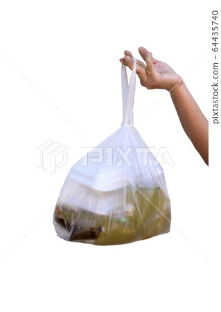 A woman's hand is holding a plastic bag to hold A woman's hand is holding a plastic bag to hold 64435740