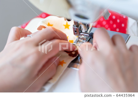 Handmade handmade woman making a sewing machine mask 64435964