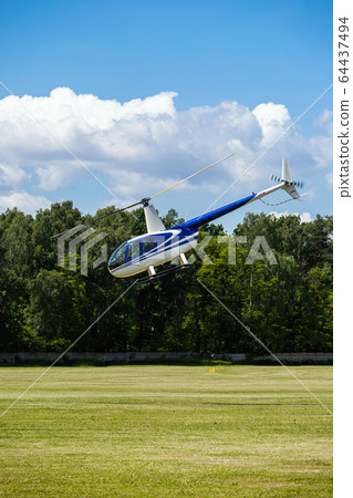 passenger helicopter flies at an air show 64437494