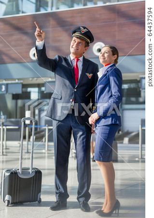 Pilot pointing aircraft while talking to flight 64437594