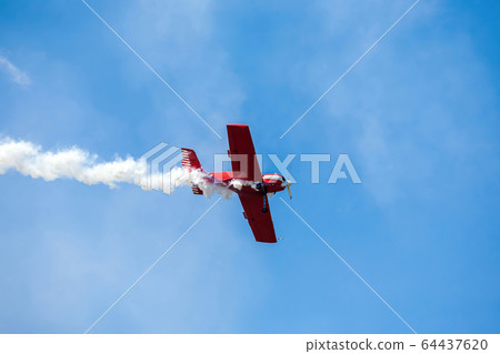 sport aircraft perform acrobatics at air shows 64437620