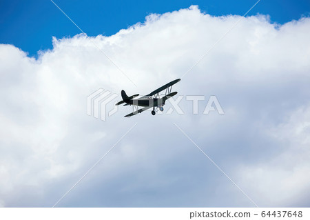 old military plane flies at air show 64437648