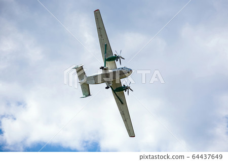 old transport plane flies at an air show 64437649