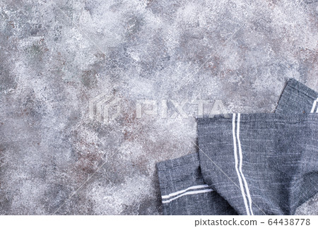 Linen napkin or towel on grey kitchen table 64438778