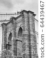 Black and white upward image of the Brooklyn Bridge in New York 64439467