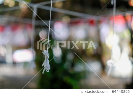 White thread in the temple for the annual prayer ceremony. Thai New Year Festival,Pray for holy things White thread in the temple for the annual prayer ceremony. Thai New Year Festival,Pray for holy things 64440205