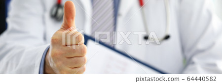 Male medicine doctor holding document pad Male medicine doctor holding document pad 64440582