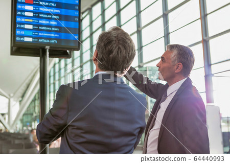 Portrait of mature businessmen looking at their 64440993
