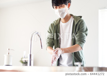 Young men washing hands Young men washing hands 64441272