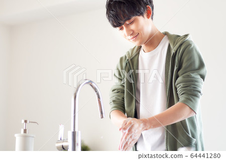 Young men washing hands Young men washing hands 64441280