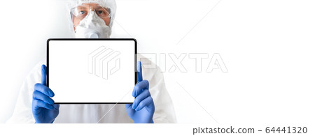 Medical doctor in protective suit with a digital tablet 64441320