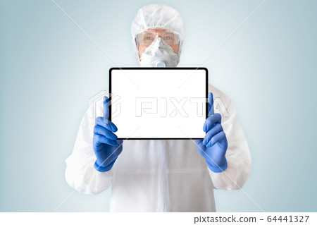Medical doctor in protective suit with a digital tablet 64441327
