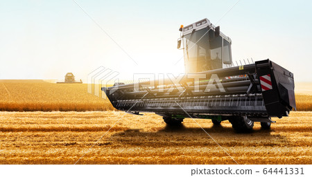 Combine harvester on the wheat field. Combine harvester on the wheat field. 64441331