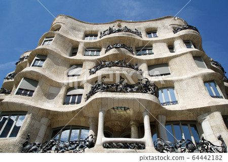 BARCELONA, SPAIN - AUG 30th, 2017: Outdoor view Gaudi's creation-house Casa Mila during a sunny day. 64442182