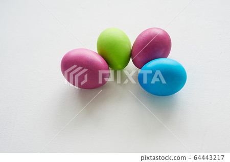 Painted multicolored eggs against a light background. Diet, protein, protein. Preparing for Easter. Painted multicolored eggs against a light background. Diet, protein, protein. Preparing for Easter. 64443217