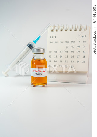 Covid-19 vaccine, syringe injection and Calendar of April 2020 Covid-19 vaccine, syringe injection and Calendar of April 2020 64443603