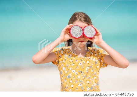 Adorable little girl have fun at tropical beach during vacation 64445750