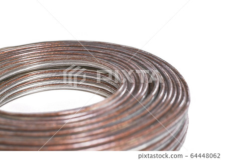 Audio cable lies on a white background Audio cable lies on a white background 64448062