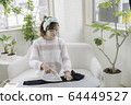 Woman ironing 64449527