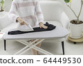 Woman ironing 64449530