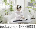 Woman ironing 64449533