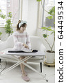 Woman ironing 64449534