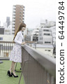 Woman on the roof of the building 64449784