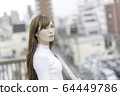 Woman on the roof of the building 64449786