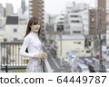 Woman on the roof of the building 64449787