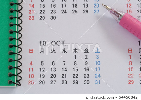 Calendar, notebook (green), pen, October 64450842