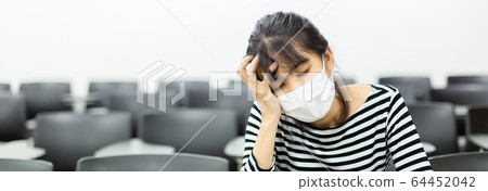 close up face asian young woman wearing medical mask for prevent dust and infection virus. 64452042