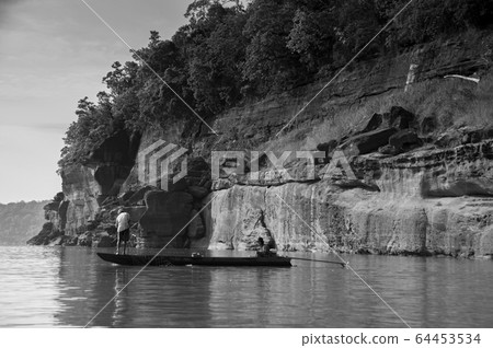 Large Sand stone canyon cliff shoreline of Mekong river Large Sand stone canyon cliff shoreline of Mekong river 64453534