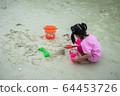 Children playing sand on Koh Samet beach 64453726