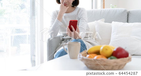 Female smartphone housewife 64454287