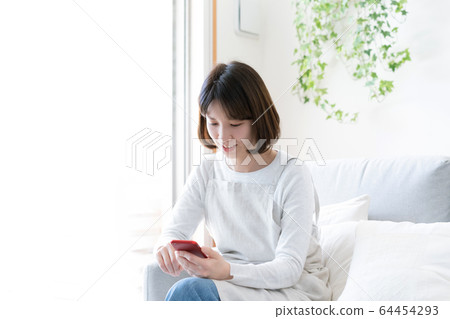 Female smartphone housewife 64454293