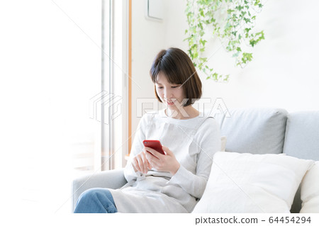 Female smartphone housewife 64454294