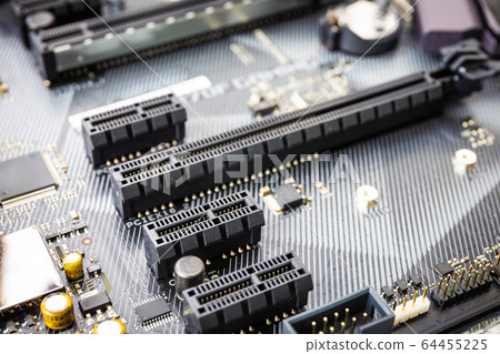 closeup of Pci expess port slot on modern black motherboard. Select focus closeup of Pci expess port slot on modern black motherboard. Select focus 64455225